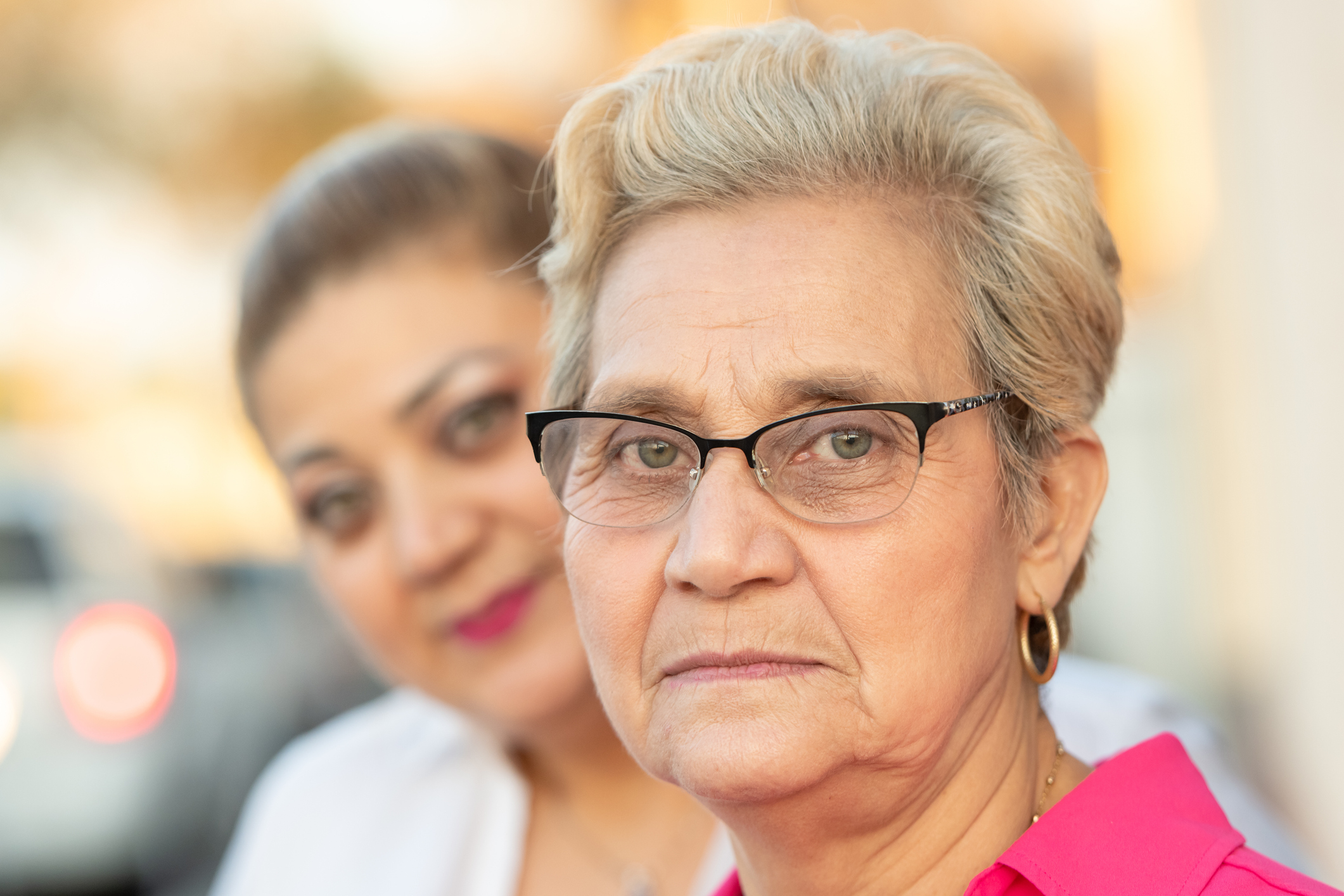 Portrait of two multiracial women.