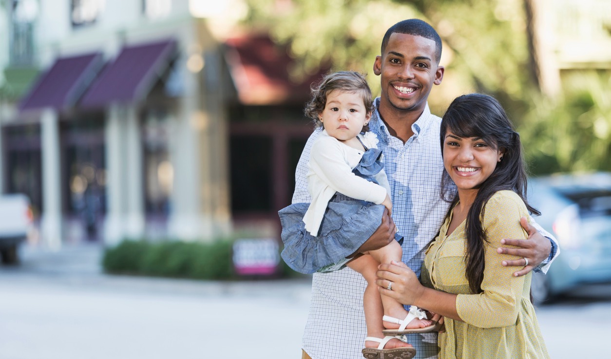 Happy family portrait on the street.