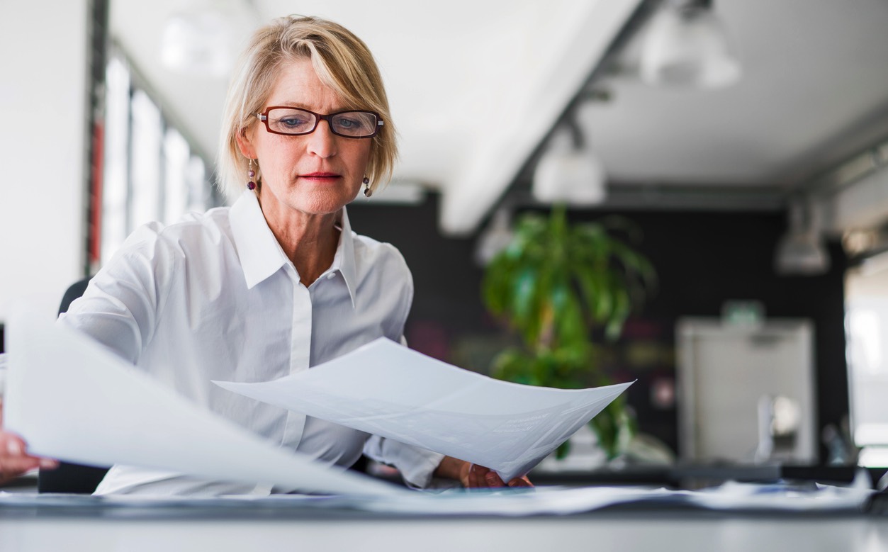 Woman reviewing documents.